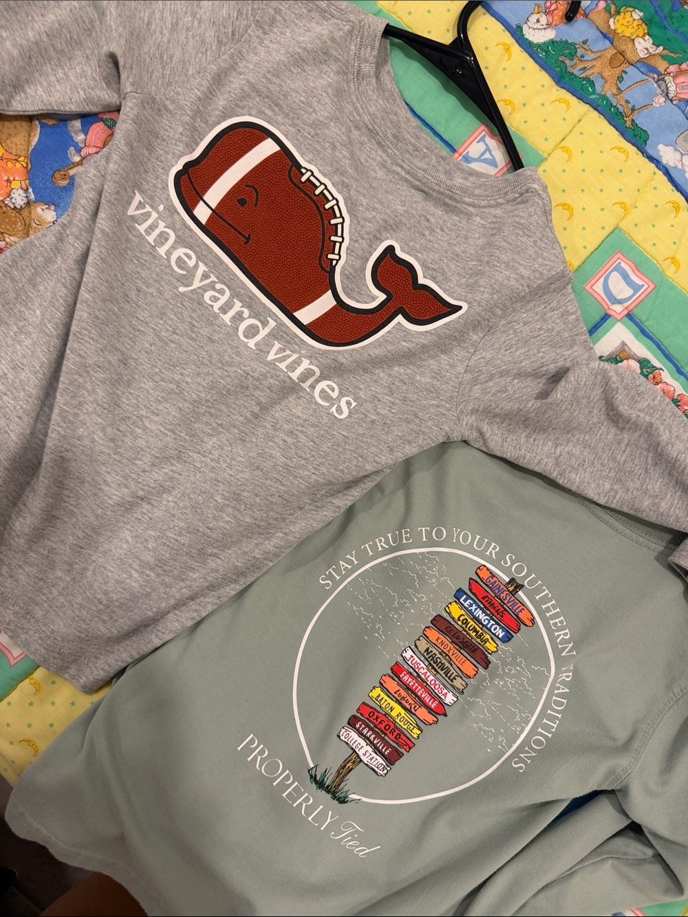 Two properly tied Vineyard Vines Kids Gray Football Whale Long-Sleeve Shirt